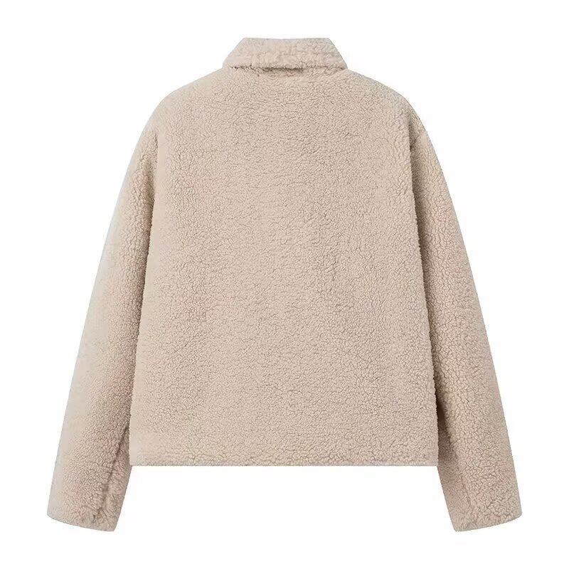 Fluffy teddy coat for women with elegant lapels and practical piped pockets Lune London