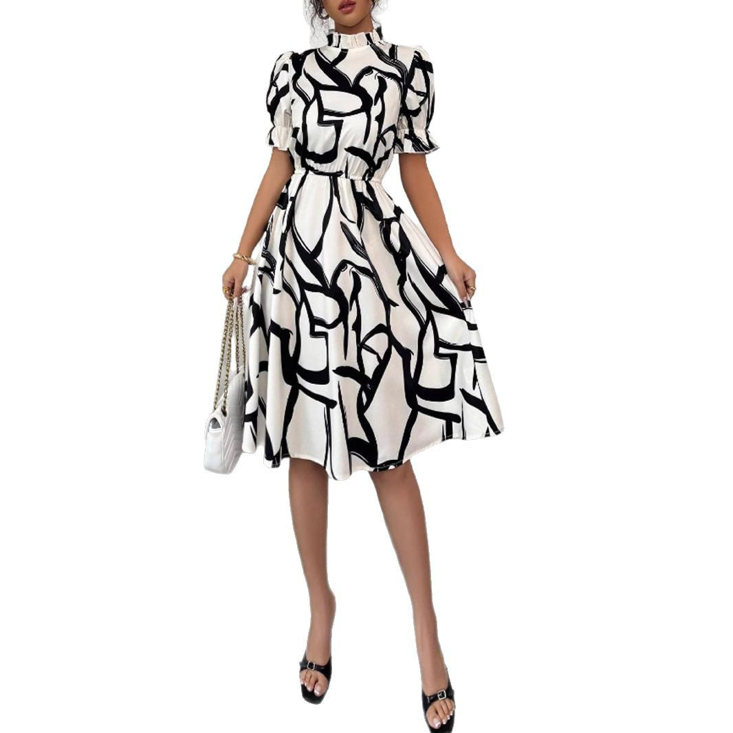 Robe midi élégante pour femmes avec motif de plantes stylé et taille élastique Chic & Stil