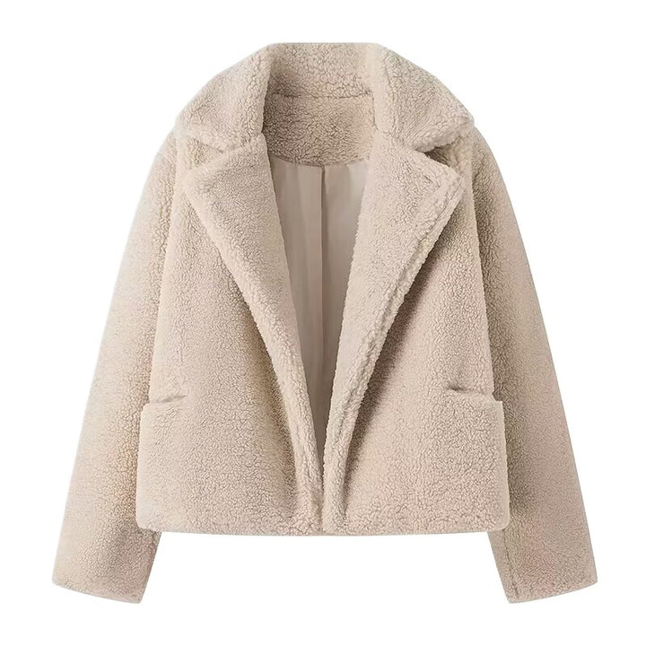 Fluffy teddy coat for women with elegant lapels and practical piped pockets Lune London