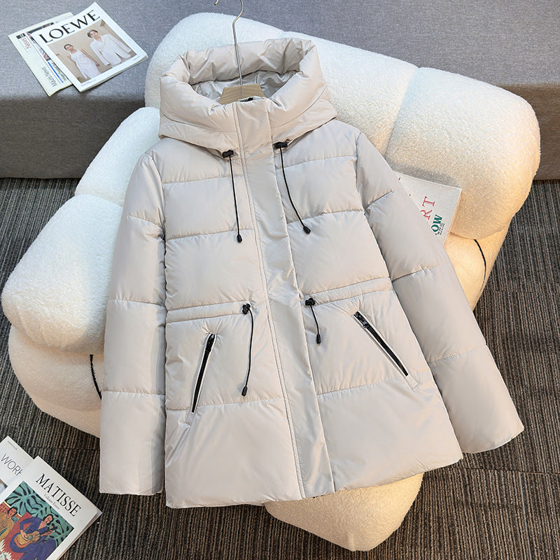 Insulated quilted jacket for women with a high collar and functional zip pockets Lune London