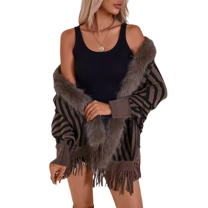 Ladies knitted poncho with elegant faux fur collar and fringe design Lune London