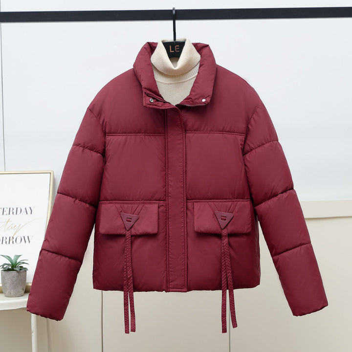 Quilted transitional jacket for women with high collar and practical modern pockets Lune London