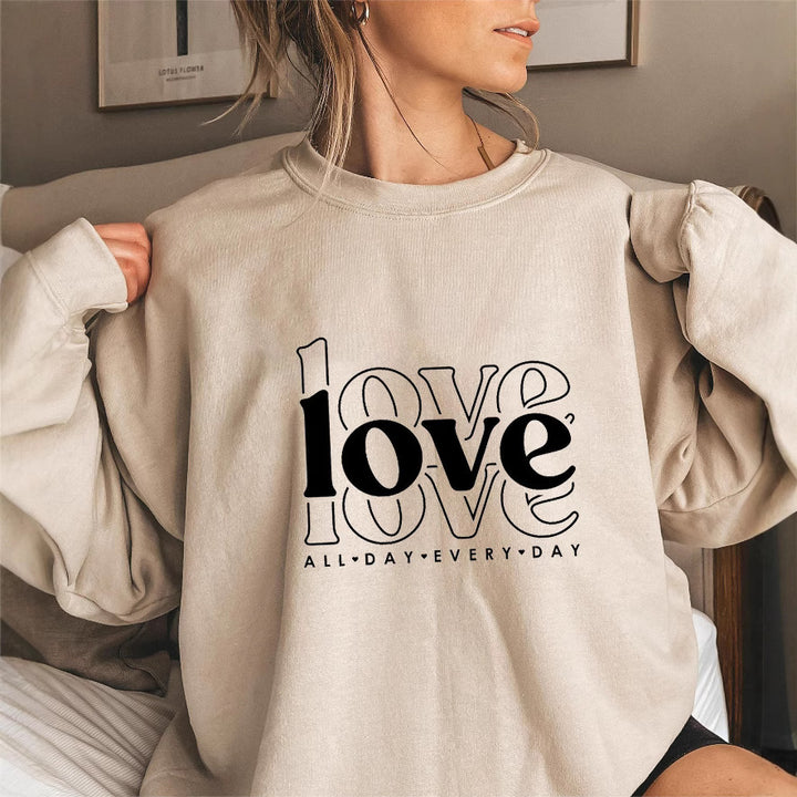 Sweat-shirt pour femmes avec des manches volumineuses et imprimé moderne "love" Chic & Stil