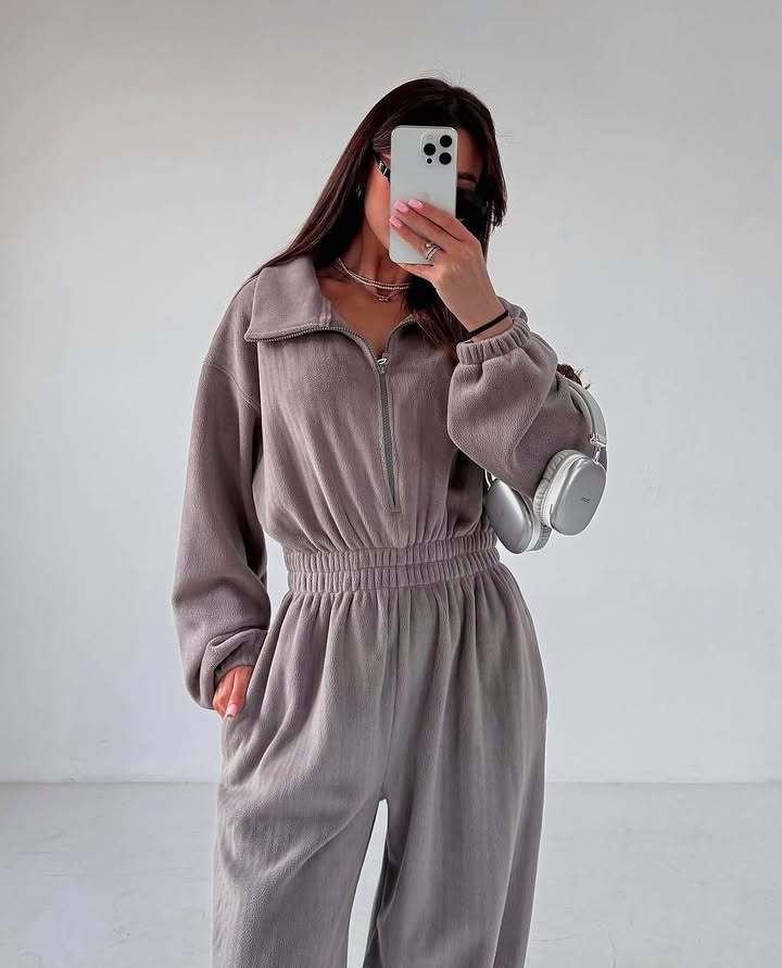 Ladies fleece jumpsuit with large puff sleeves and a high collar Lune London