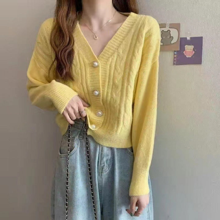 Knitted jacket for women with an elegant braid pattern and high-quality button details Lune London