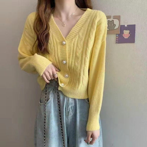 Knitted jacket for women with an elegant braid pattern and high-quality button details Lune London