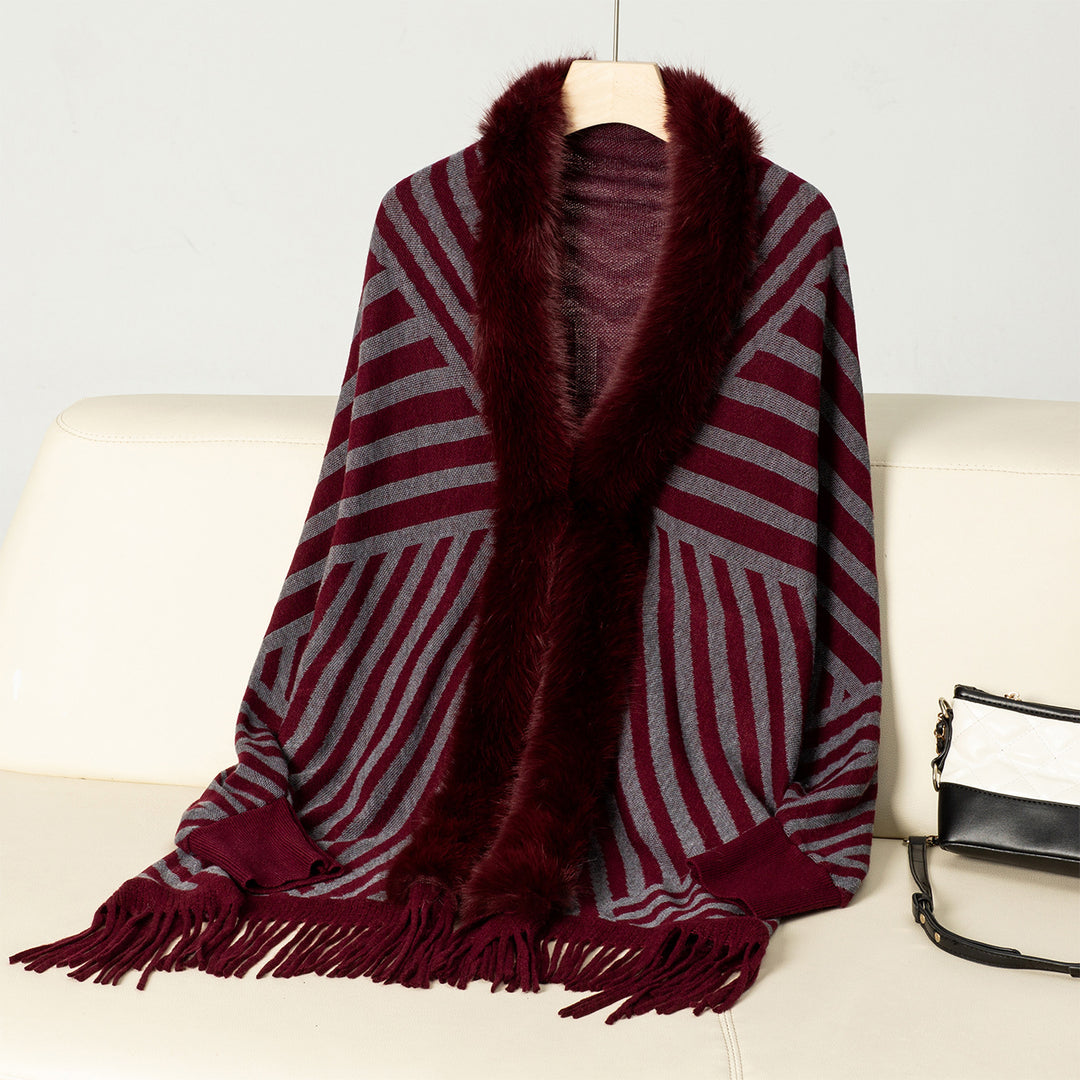 Ladies knitted poncho with elegant faux fur collar and fringe design Lune London