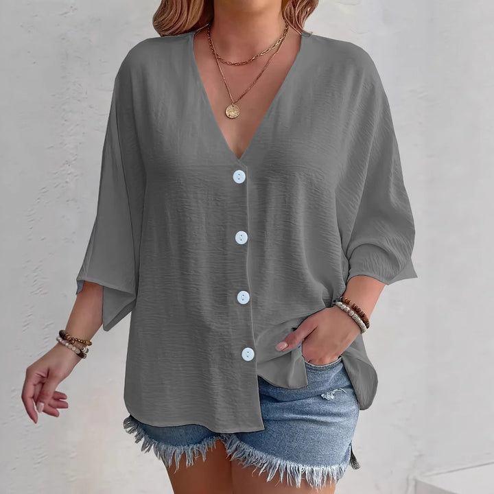Short-sleeved advantageous blouse for ladies with button placket and V neckline Lune London