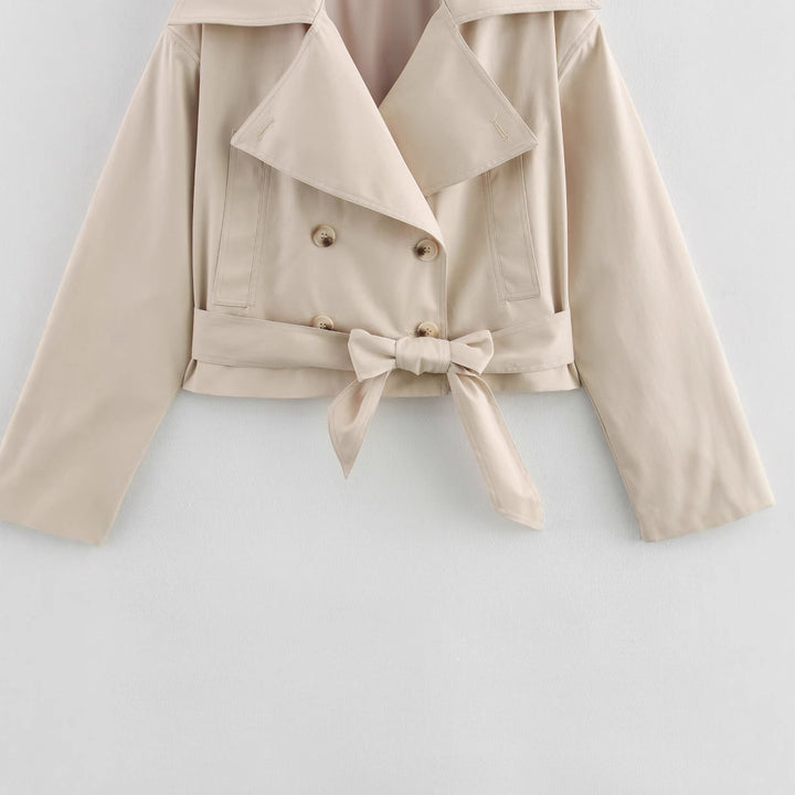 Elegant cropped trench coat for women with stylish button details and a chic belt detail
