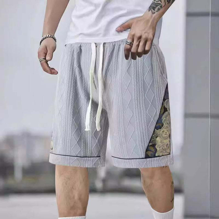 Men's athletic leisure pants with a creative floral design Lune London