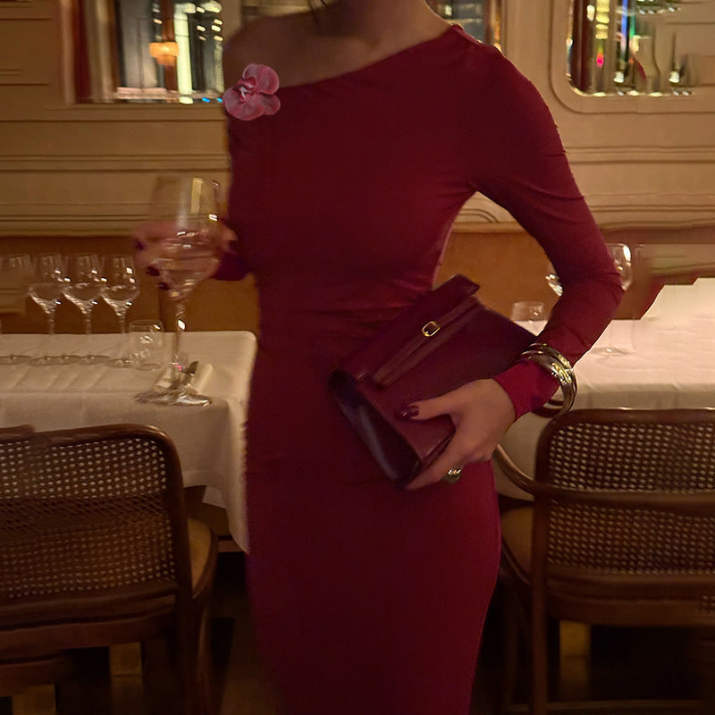 Ladies elegant long-sleeved evening dress with asymmetric neckline and figure-flattering design