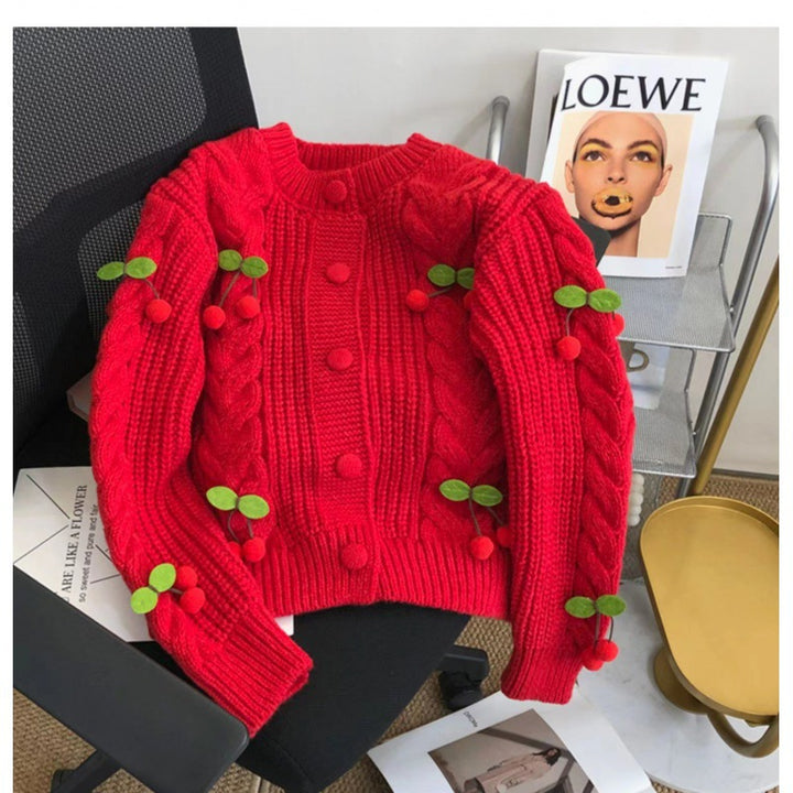Women's knit jacket with playful cherry pattern and elegant braid patterns Lune London