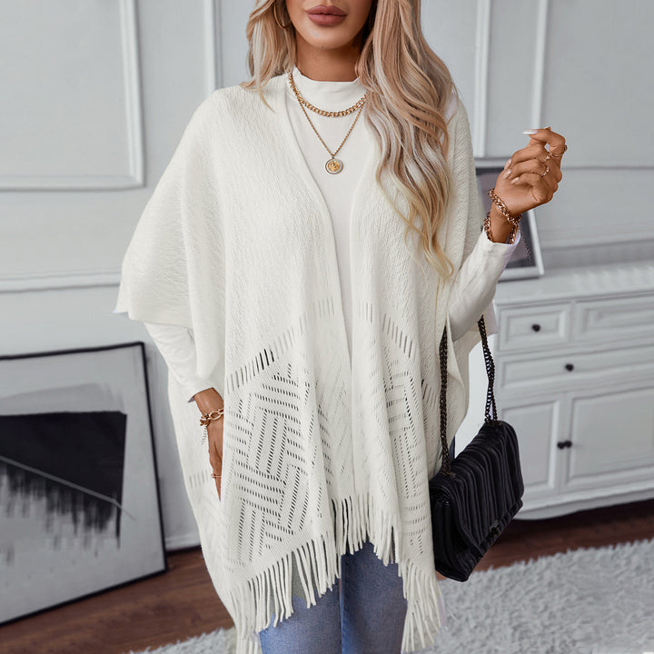 Elegant knitted poncho for women with fringe details and a distinctive pattern Lune London