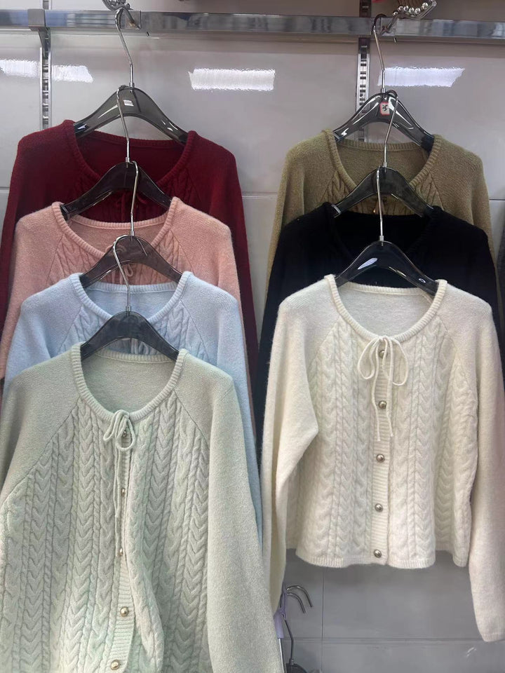 Women’s knitted jacket with embossed pattern and decorative button details Lune London