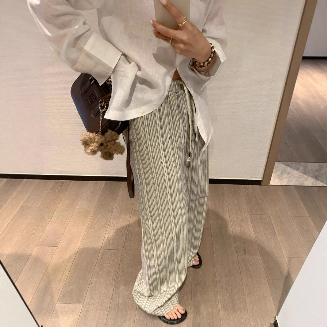 Casual pleated trousers for women with side pockets and elastic waistband Lune London