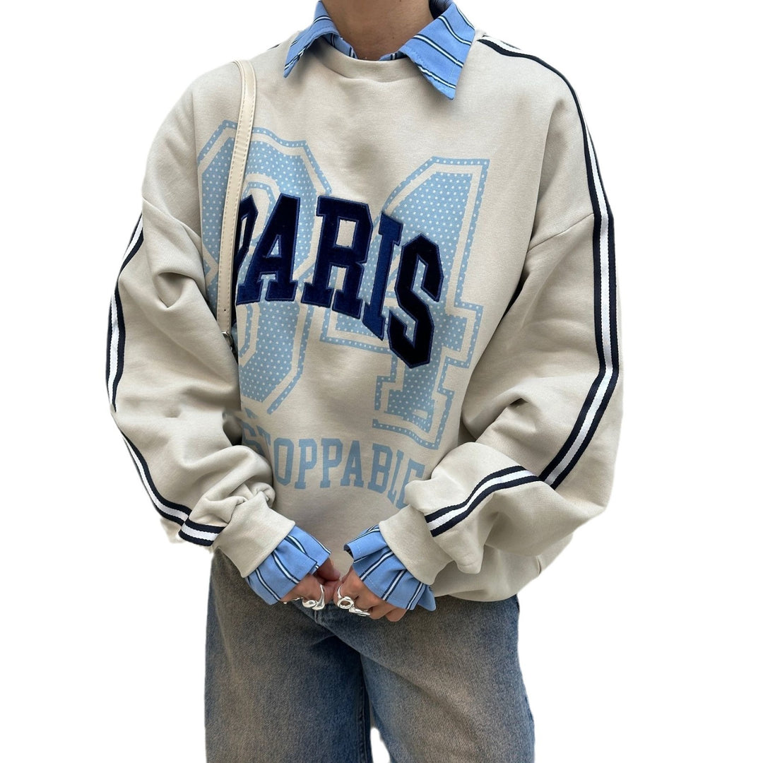 Oversized sweatshirt for women with Paris fashion print and striped accents Lune London