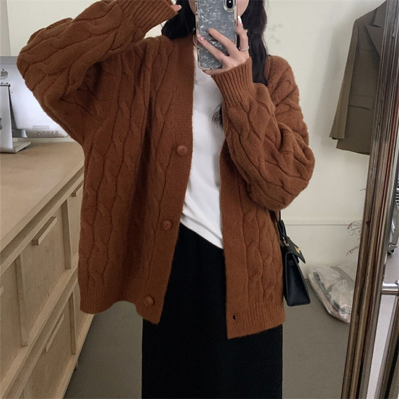 Ladies large knit cardigan with an elegant cable pattern and comfortable button details Lune London