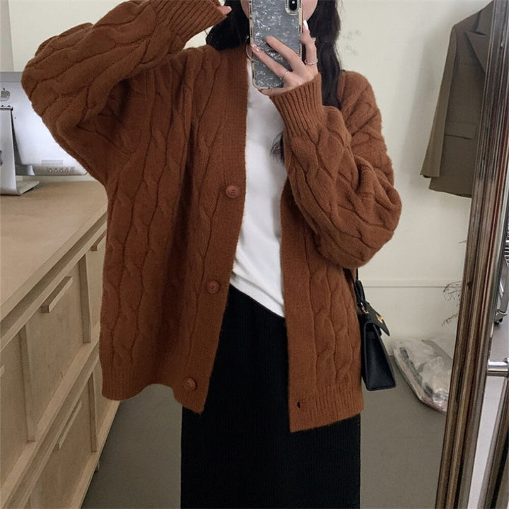 Ladies large knit cardigan with an elegant cable pattern and comfortable button details Lune London