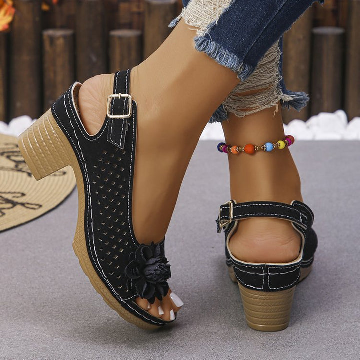 Women's clogs with a decorative floral detail and a perforated surface Lune London