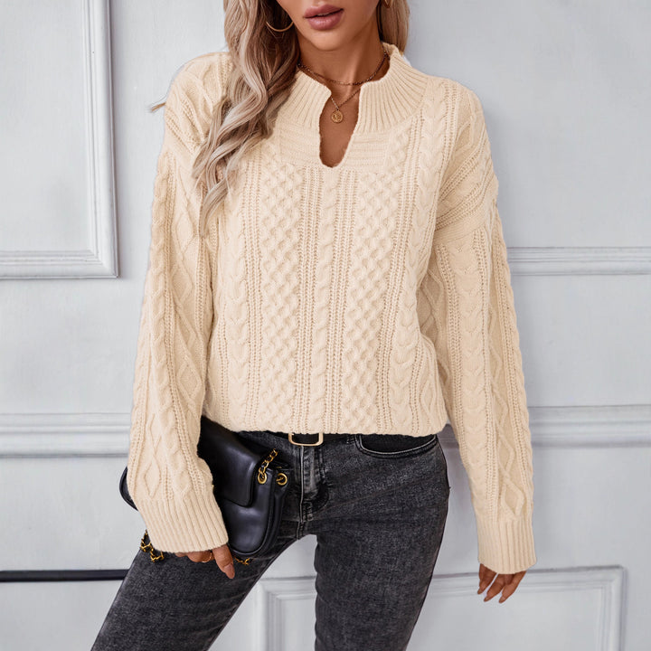 Fashionable women's knitted sweater with a unique cable design and a chic round neck. Lune London