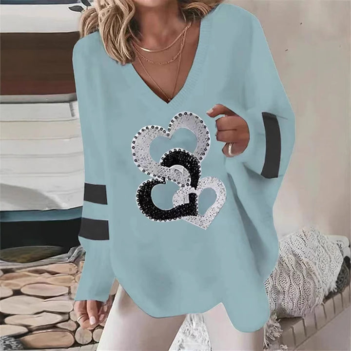 Hoodie pour femmes avec motif cœur et élégantes rayures contrastées Chic & Stil