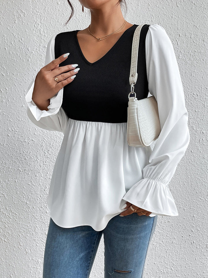 Ladies elegant top with asymmetrical V-neck and puff sleeves Lune London