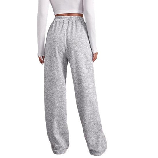 Women's loose-fitting leisure pants with elastic waistband and side pockets Chic & Stil