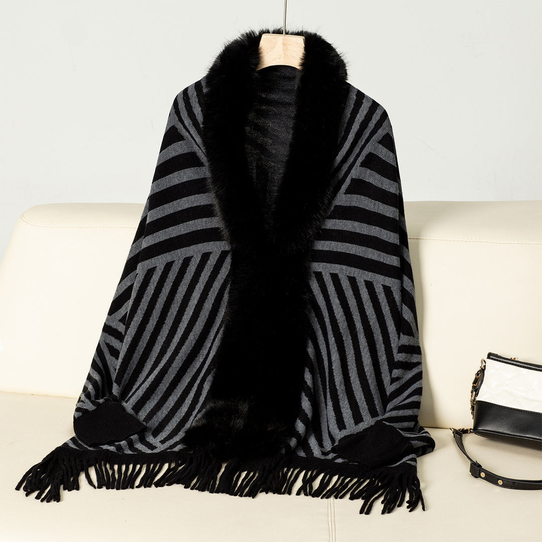Ladies knitted poncho with elegant faux fur collar and fringe design Lune London