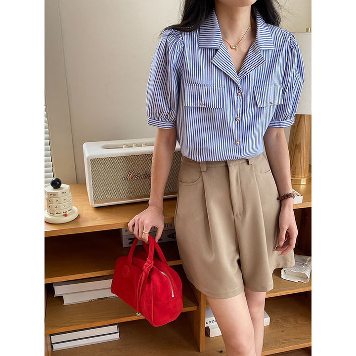 Women's short sleeve blouse with subtle striped pattern and decorative button details Chic & Stil