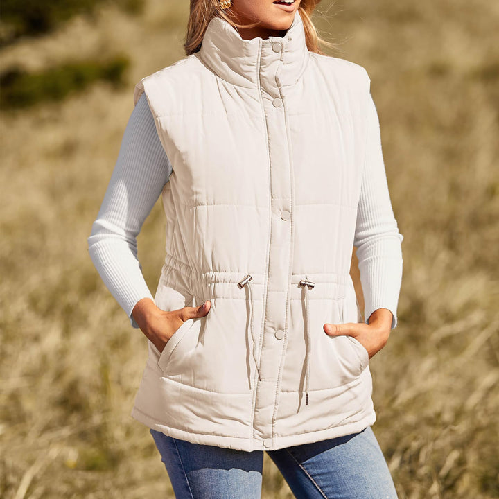 Ladies sleeveless down jacket with high collar and practical zippered pockets Lune Londonl