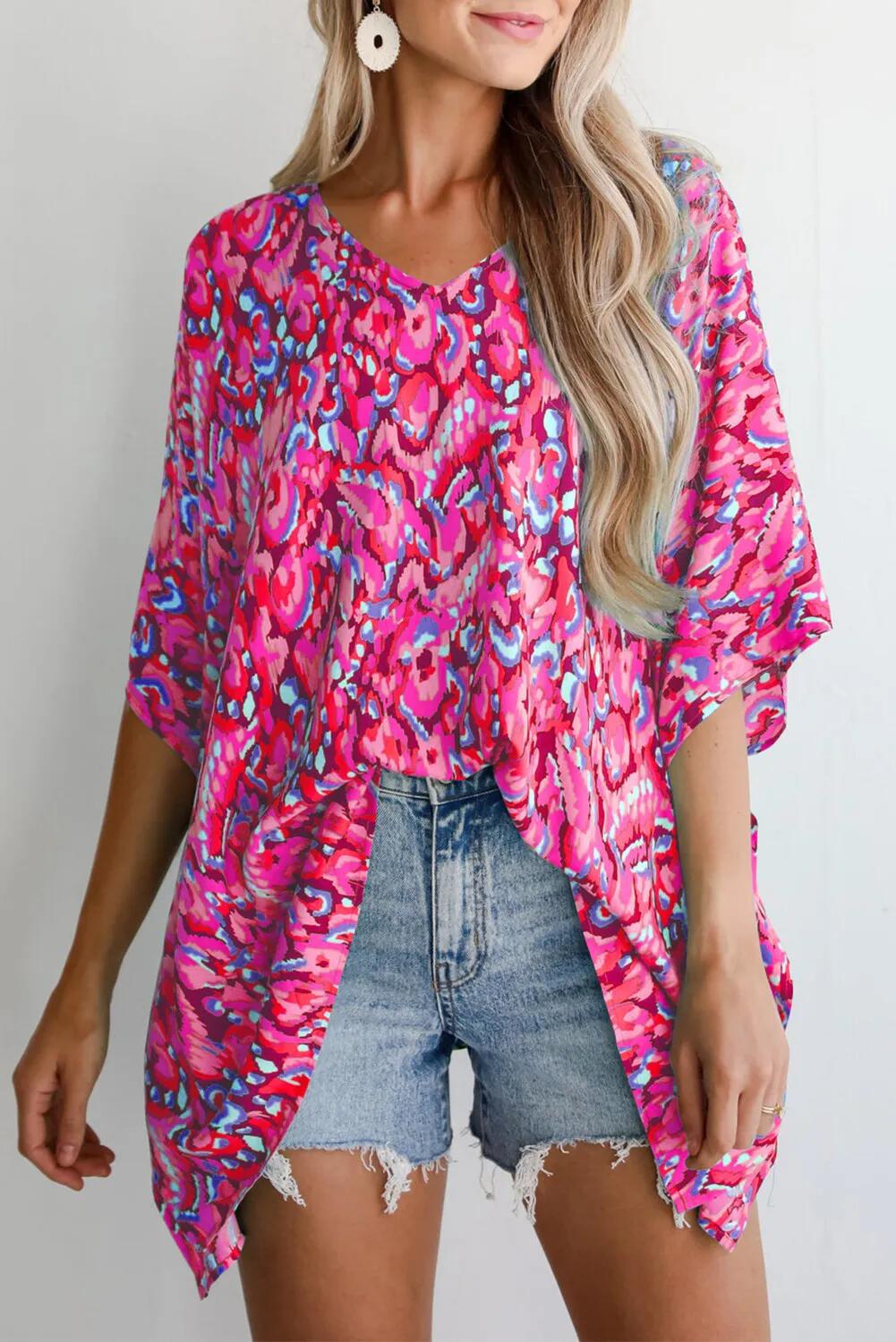 Casual beach blouse for women with an asymmetrical cut and colorful pattern Lune London