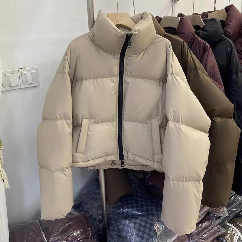 Ladies short functional quilted jacket with high collar and side pockets Lune London