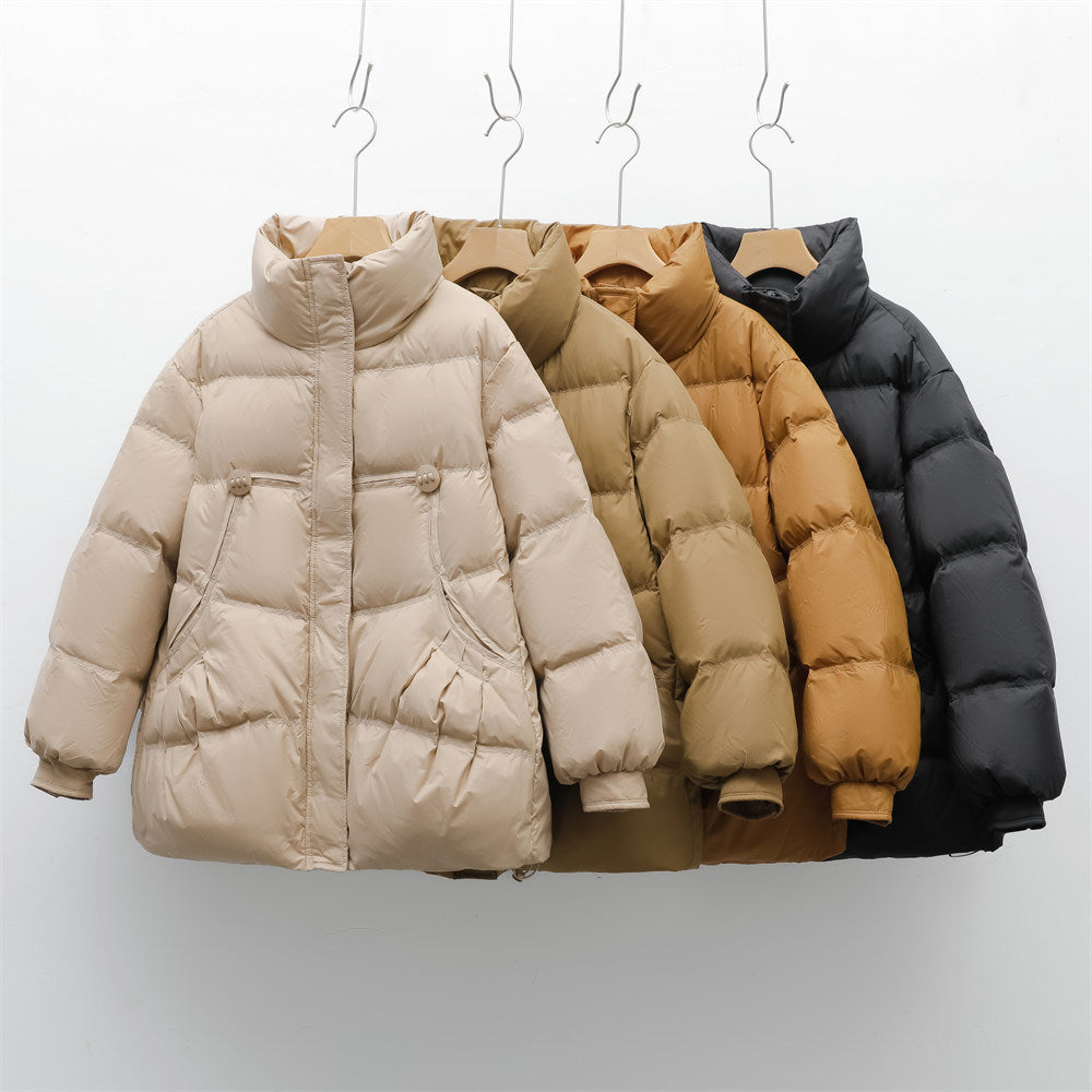 Bulky winter jacket for women with practical pockets and high collar Lune London