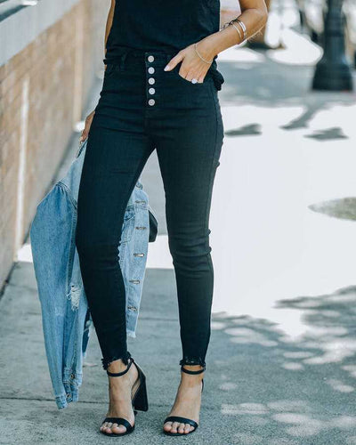 High waisted jeans for women with a modern cut featuring button detail and frayed hem Lune London