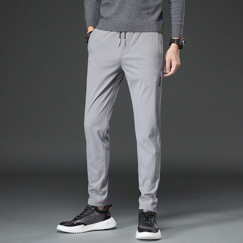 Men's slim fit sports pants with elastic waistband and practical zip pockets Lune London