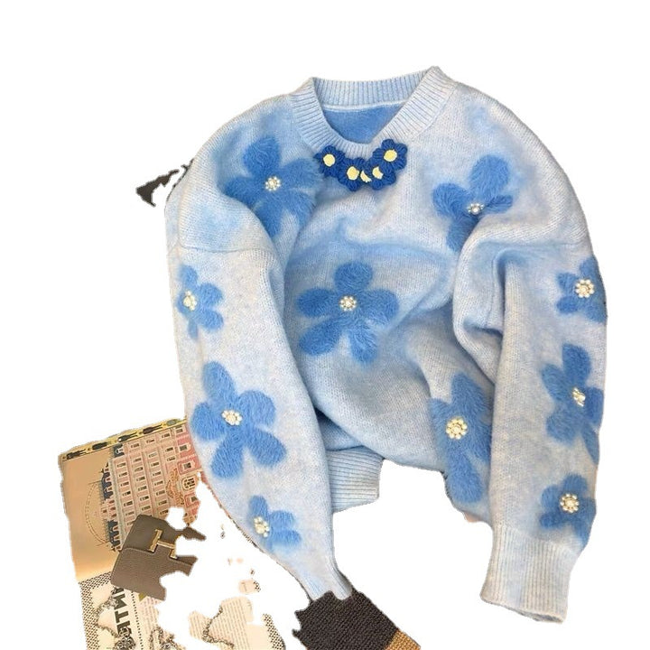 Pull en tricot pour femmes avec des appliqués floraux et des détails en perles Chic & Stil