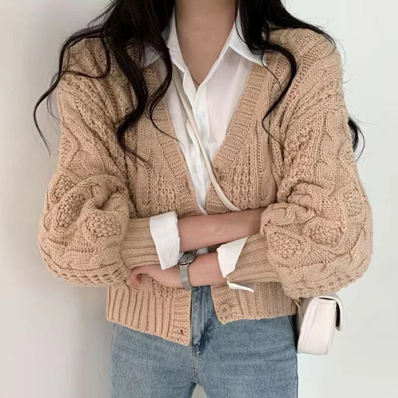 Thick knitted jacket for women with voluminous sleeves and a unique cable pattern Lune London