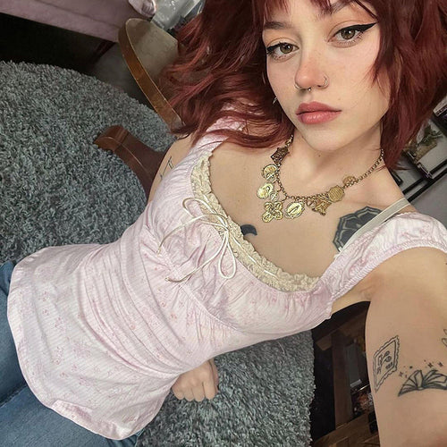 Ladies nightdress with delicate lace decoration and playful ruffle elements