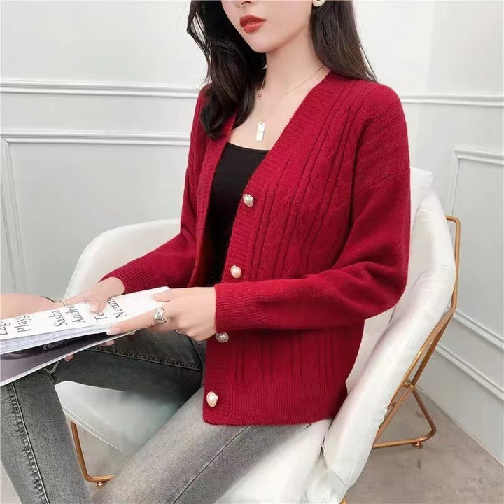 Knitted jacket for women with an elegant braid pattern and high-quality button details Lune London