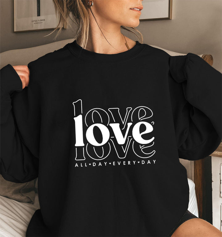 Sweat-shirt pour femmes avec des manches volumineuses et imprimé moderne "love" Chic & Stil