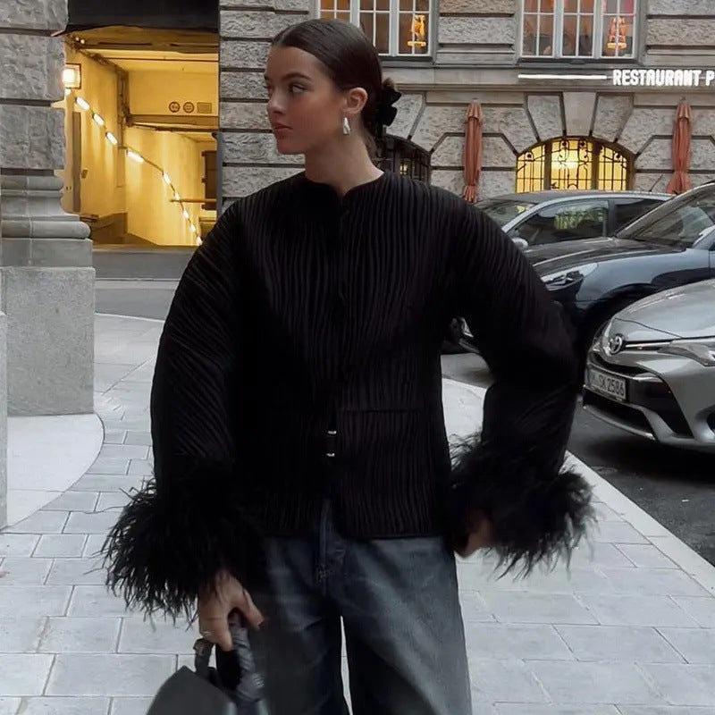 Elegant ladies' down jacket with elaborate ruffle details and high collar Lune London