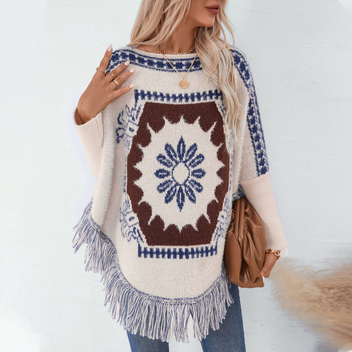Ladies elegant knitted poncho with artistic pattern and fringe finish Lune London