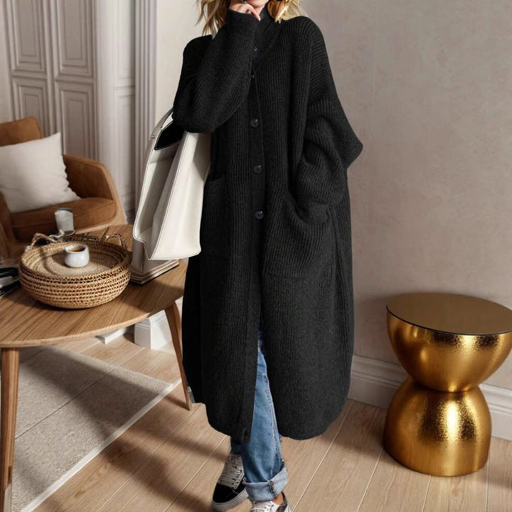 Trendy knitted jacket for women with generous pockets and chic button detail