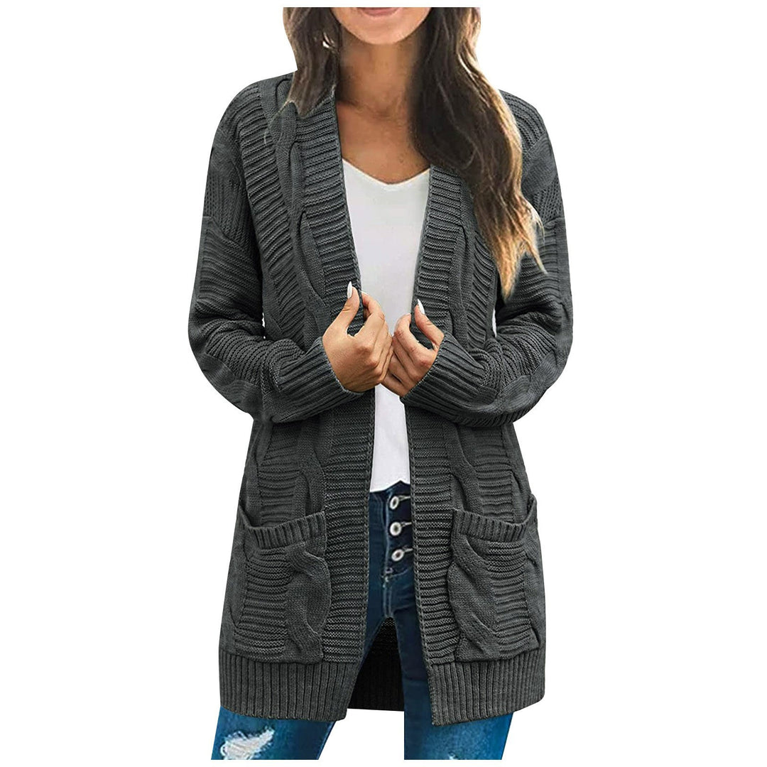 Ladies chunky knit cardigan with elegant cable patterns and practical pockets Lune London