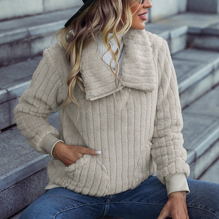 Fleece sweater for women with a high collar and side pockets. Lune London