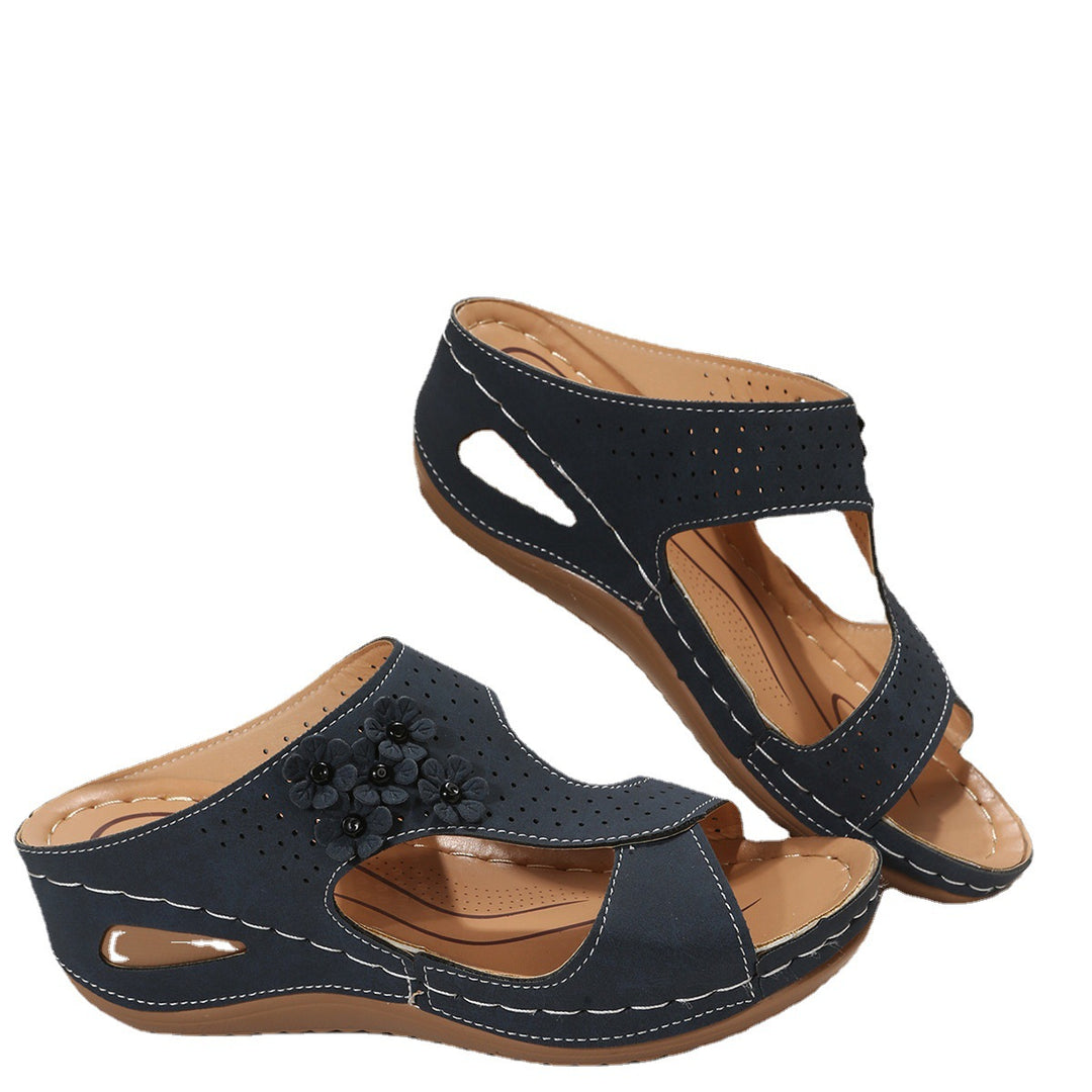 Comfortable wedge sole sandals for women with an airy surface structure and elastic straps Lune London
