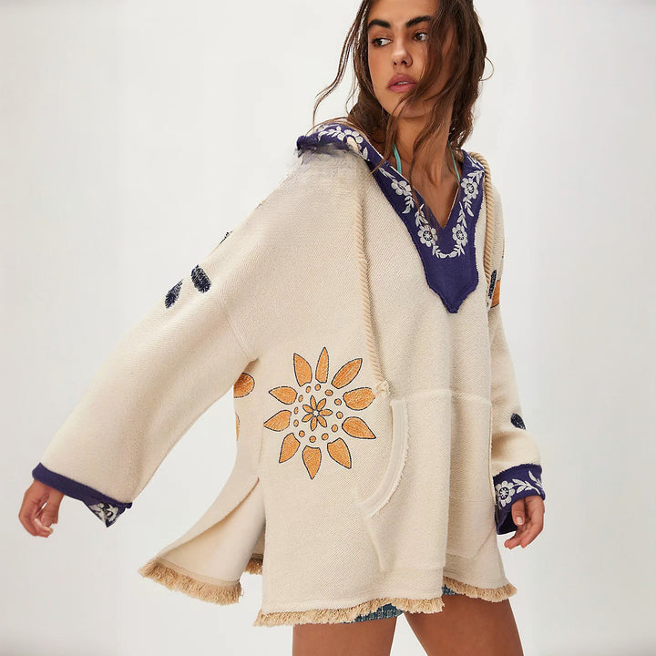 Hooded poncho for women with colorful embroidery and fringed edges Lune London