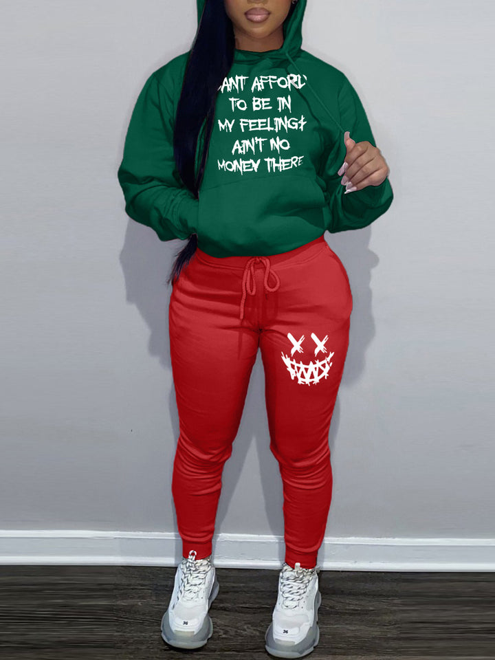 Casual women’s outfit with hoodie and jogger pants, featuring unique writing and creative patterns Lune London