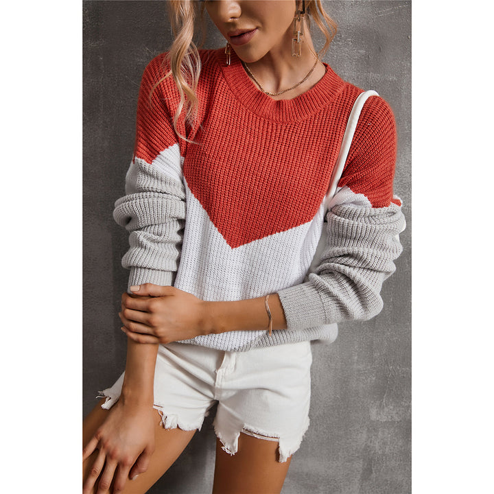 Femme pull en tricot à la mode avec un décolleté en V frappant et un design graphique Chic & Stil