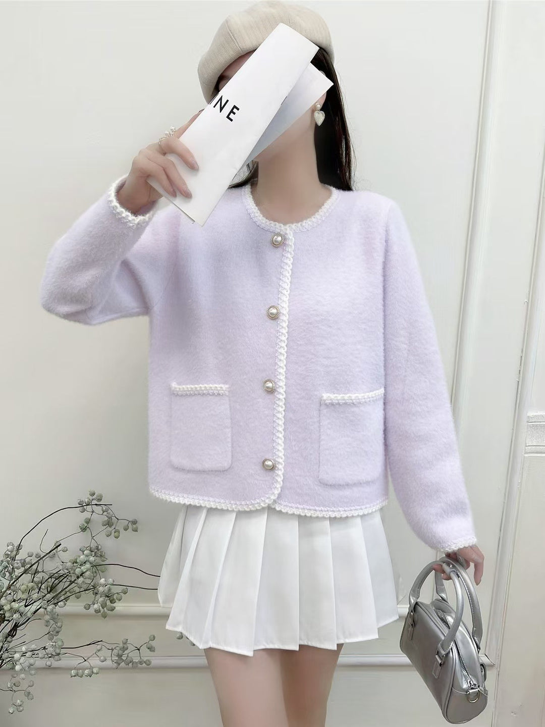 Cardigan féminin élégant avec patte de boutonnage décorative et poches
